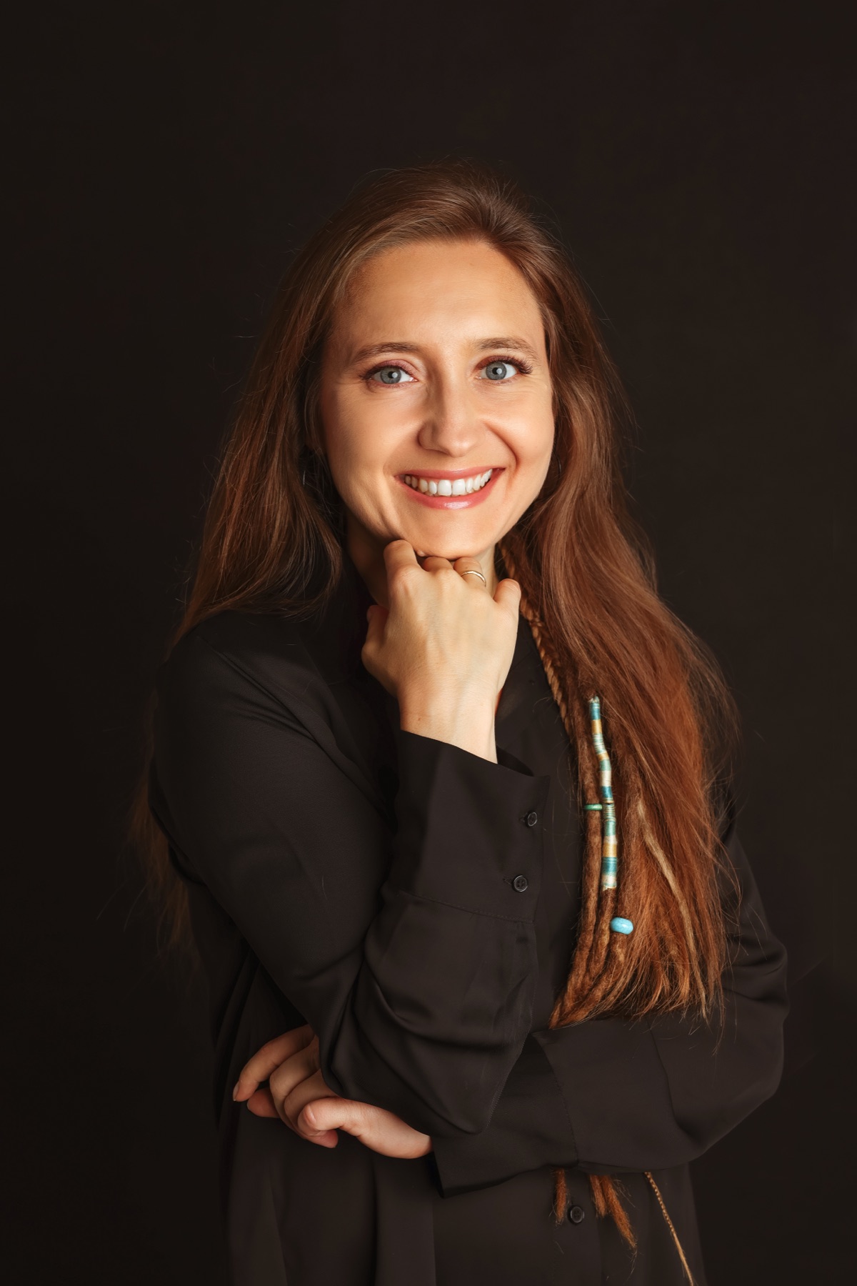 Patrycja Komorska smiling in a black blouse